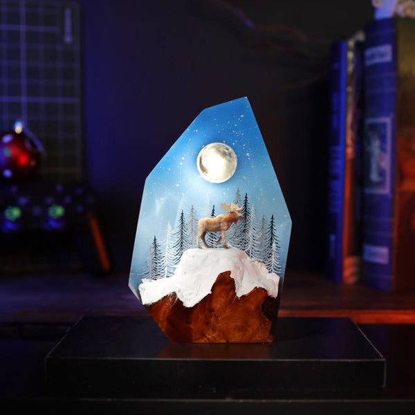 Reindeer in a winter forest lamp