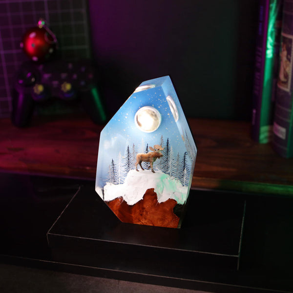 Reindeer in a winter forest lamp