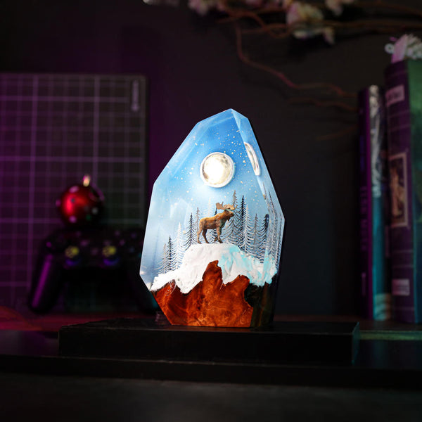 Reindeer in a winter forest lamp