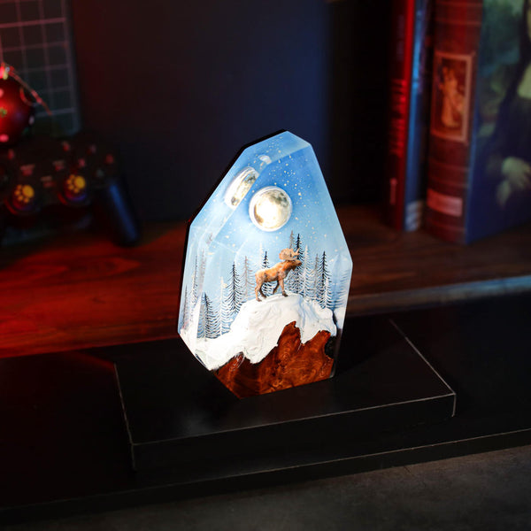 Reindeer in a winter forest lamp