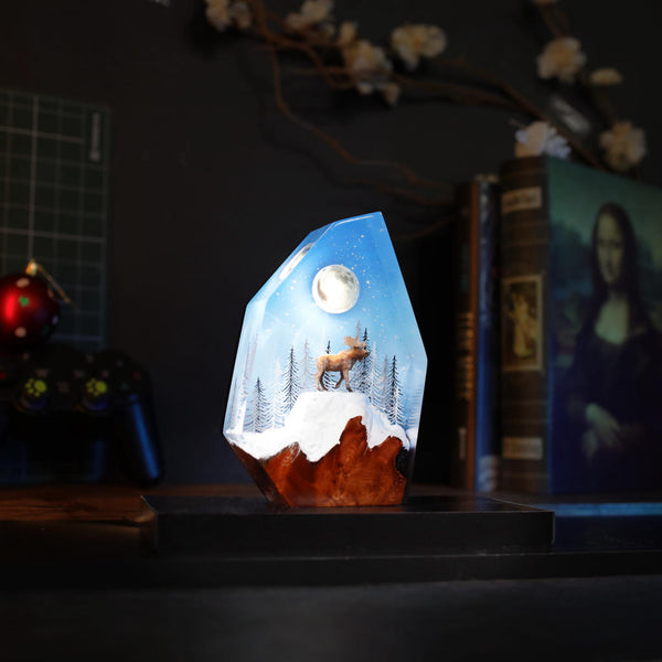 Reindeer in a winter forest lamp